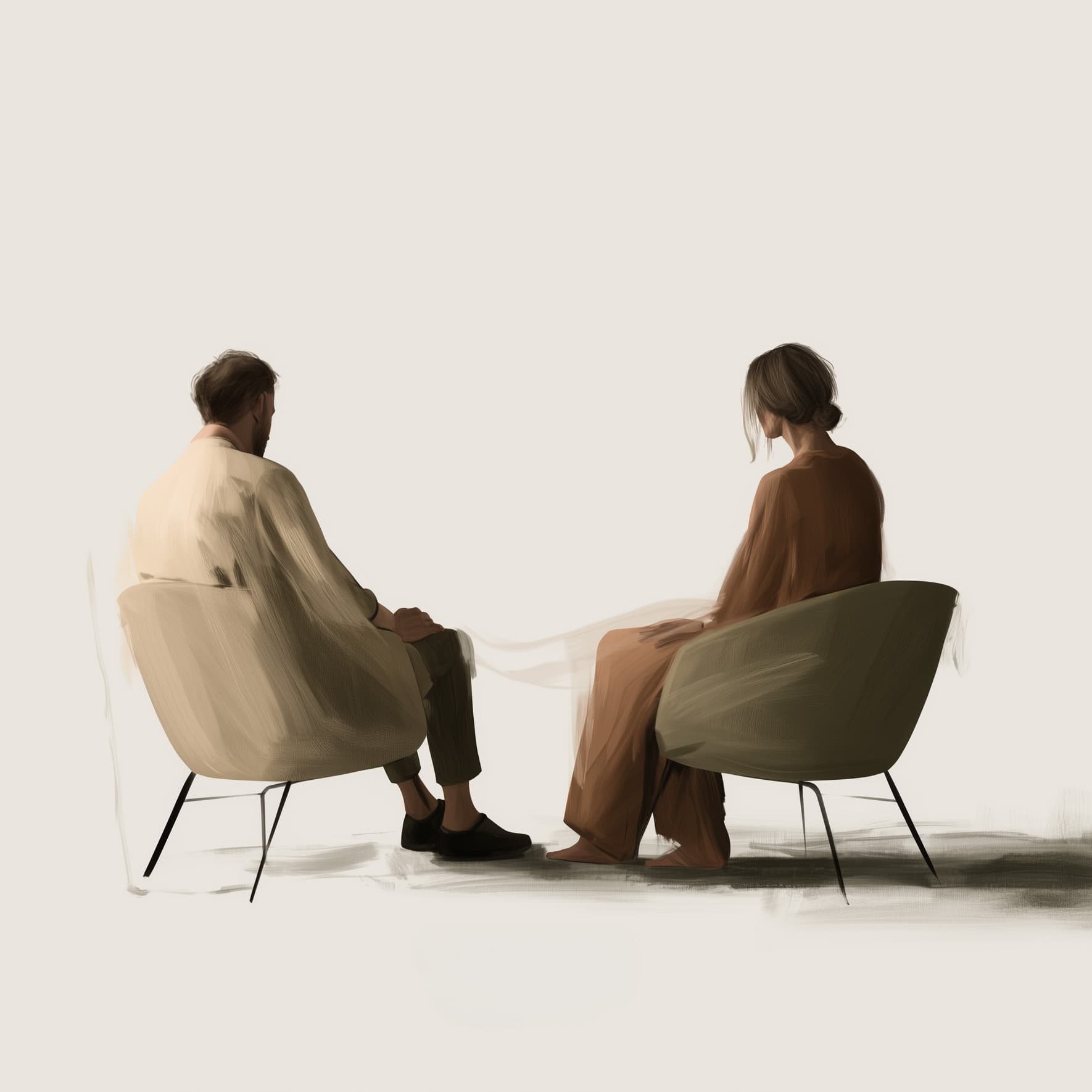 A couple seated opposite one another in a quiet therapy setting